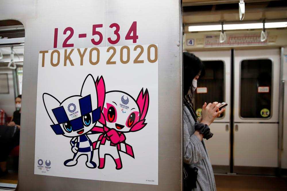 A picture of Tokyo 2020 Olympic and Paralympic mascots is seen at a train in Tokyo, Japan August 29, 2021. - Reuters