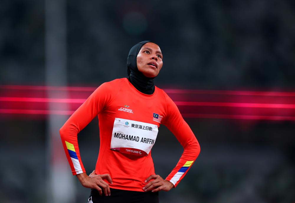 Tokyo 2020 Paralympic Games - Athletics - Women’s 400m - T20 Round 1 - Heat 2 - Olympic Stadium, Tokyo, Japan - August 30, 2021. Siti Noor Iasah Mohamad Ariffin of Malaysia reacts after competing REUTERSpix