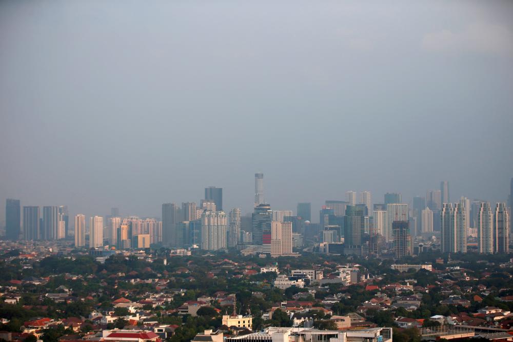 FILE PHOTO: A general view of business buildings as ssmog covers the capital city of Jakarta, Indonesia, July 4, 2019. REUTERSpix