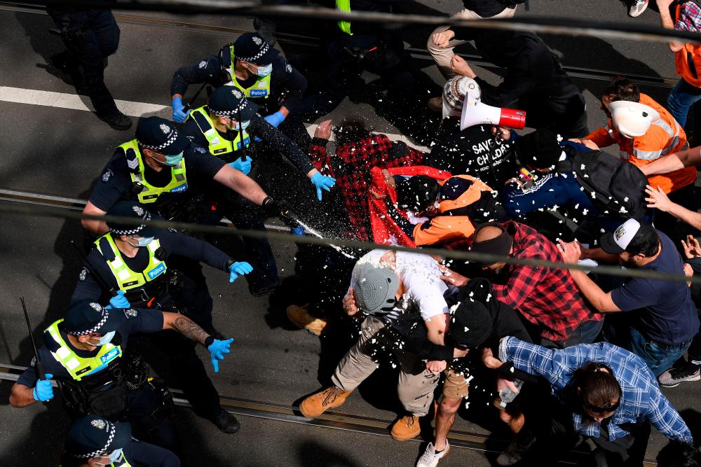 Victoria police clash with protesters during a “The Worldwide Rally for Freedom” demonstration in Melbourne, Australia September 18, 2021. REUTERSpix