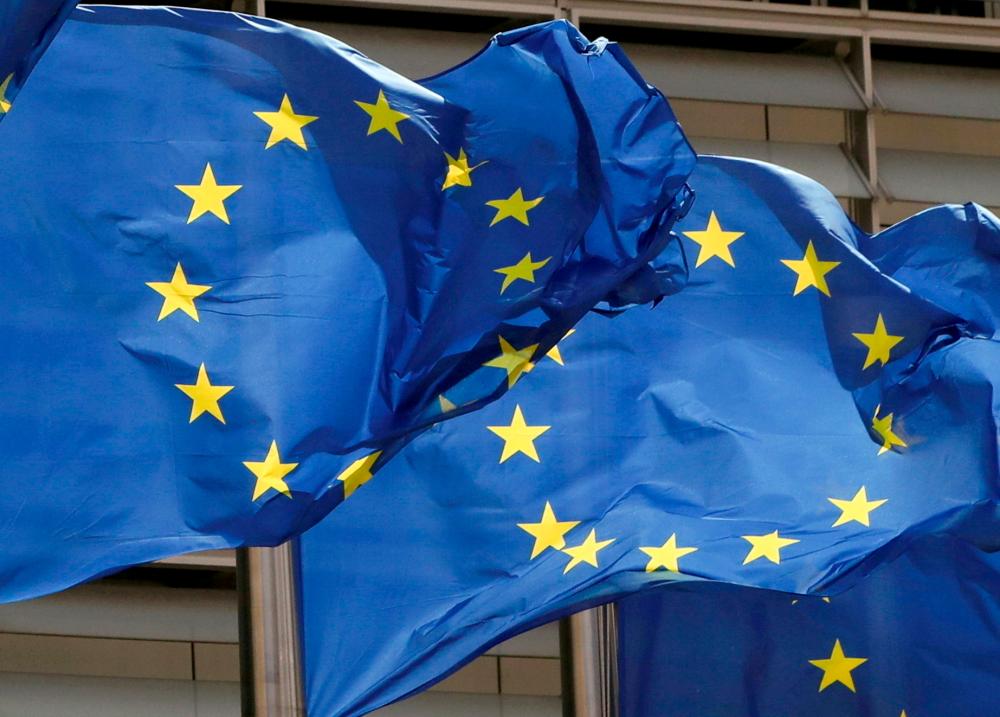 FILE PHOTO: European Union flags flutter outside the EU Commission headquarters in Brussels, Belgium May 5, 2021. REUTERSpix