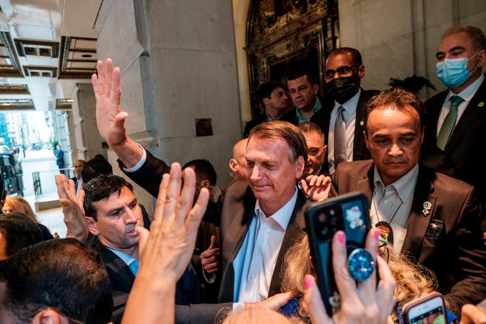 Brazil’s President Jair Bolsonaro greets supporters outside his hotel during the 76th Session of the UN General Assembly in New York, US, September 21, 2021. REUTERSpix