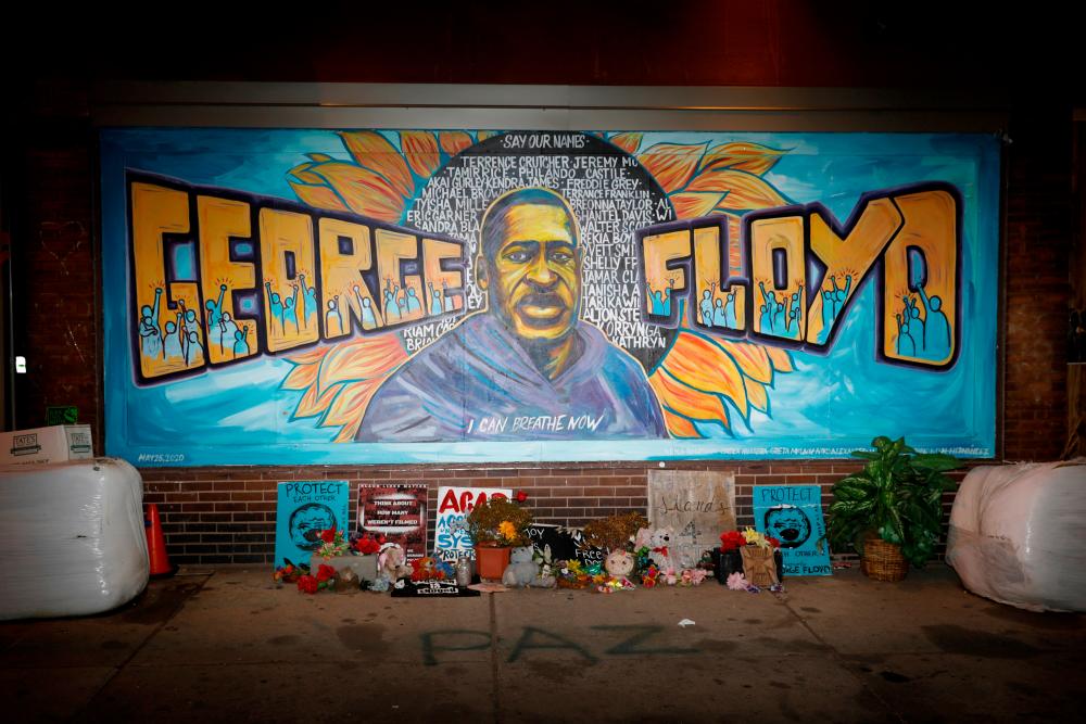 FILE PHOTO: A view of the George Floyd mural at 38th Street and Chicago Avenue a day before opening statements in the trial of former police officer Derek Chauvin, who is facing murder charges in the death of George Floyd, in Minneapolis, Minnesota, U.S., March 28, 2021. REUTERSpix