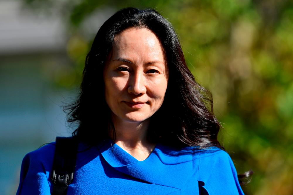 FILE PHOTO: Huawei Technologies Chief Financial Officer Meng Wanzhou leaves her home to attend a court hearing in Vancouver, British Columbia, Canada, August 4, 2021. REUTERSpix