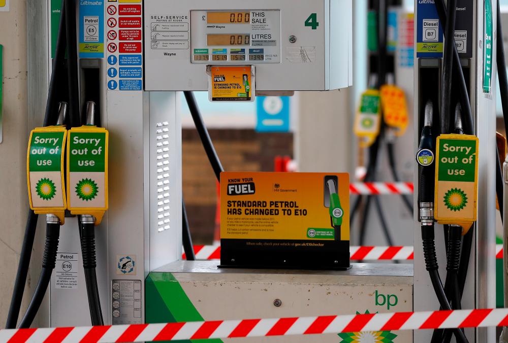 ‘Out of use’ signs are seen on petrol pumps at a filling station in London, Britain, September 25, 2021. REUTERSpix