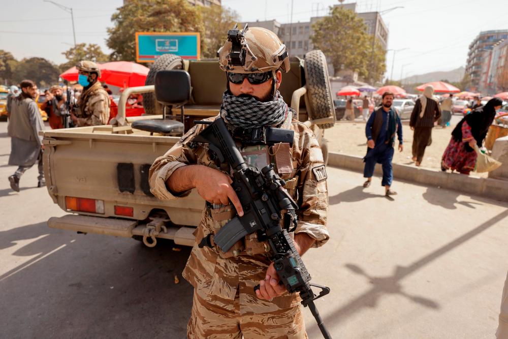 A member of Taliban forces stands guard on a street in Kabul, Afghanistan, October 3, 2021. REUTERSPIX