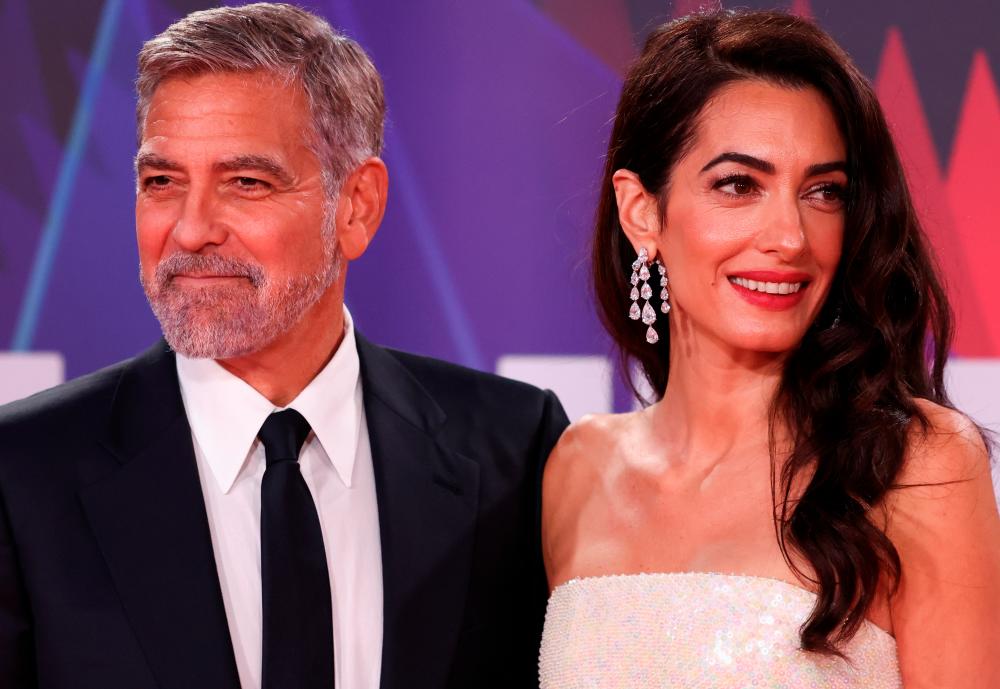 Director George Clooney and his wife lawyer Amal Clooney arrive for a screening of the film “The Tender Bar” as part of the BFI London Film Festival, in London, Britain, October 10, 2021. REUTERSpix