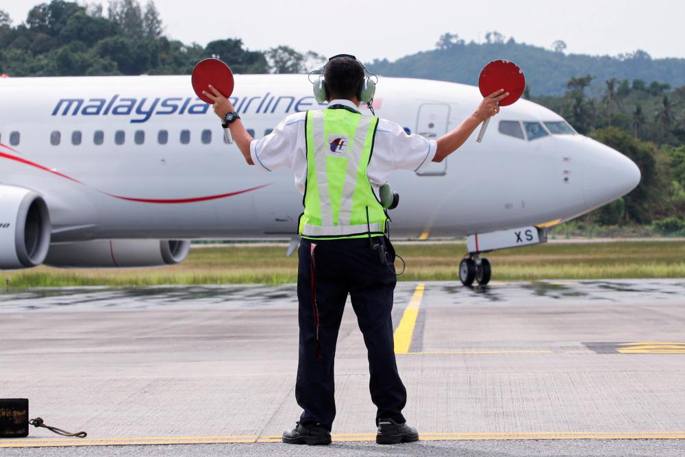 A Malaysia Airlines plane carrying the first batch of tourists arrives as Langkawi reopens to domestic tourists, amid the coronavirus disease (Covid-19) pandemic, in Malaysia September 16, 2021. REUTERSpix