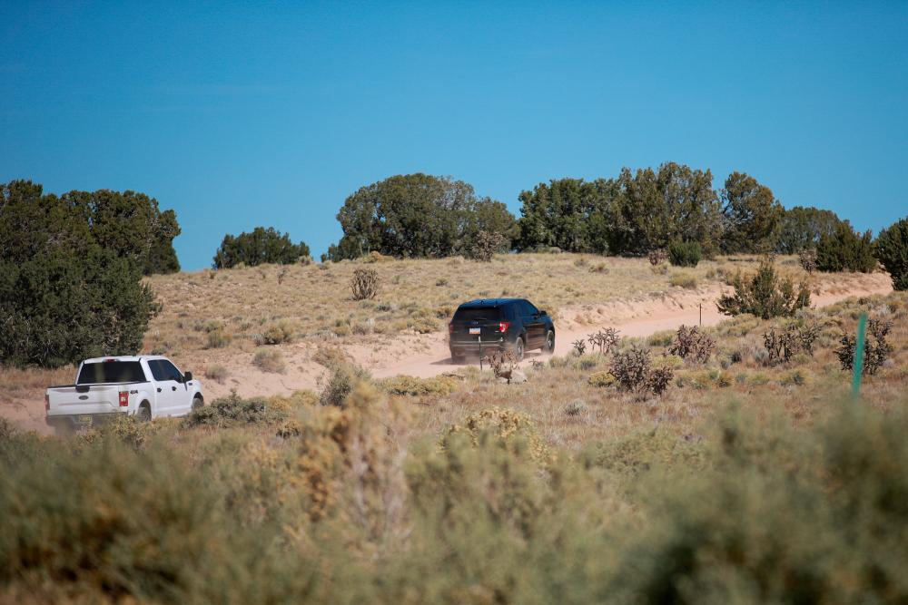 Unmarked police units from the Santa Fe County Sheriffs Department drive onto the Bonanza Creek Ranch where on the film set of “Rust” Hollywood actor Alec Baldwin fatally shot cinematographer Halyna Hutchins and wounded a director when he discharged a prop gun on the movie set in Santa Fe, New Mexico. REUTERSpix