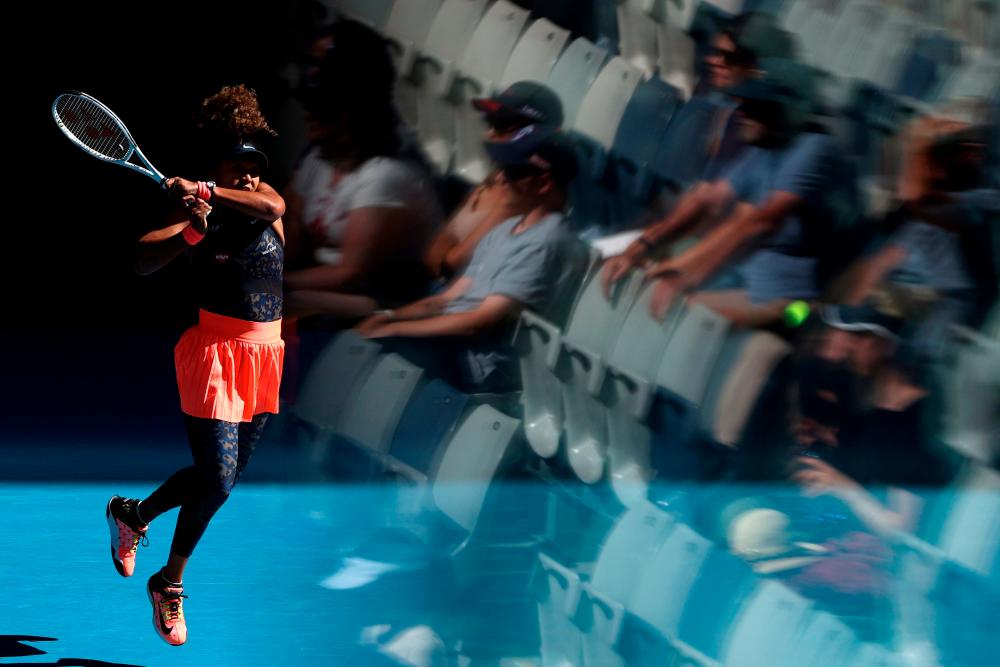 Tennis - Australian Open - Melbourne Park, Melbourne, Australia, February 12, 2021 Japan's Naomi Osaka in action during her third round match against Tunisia's Ons Jabeur REUTERSpix