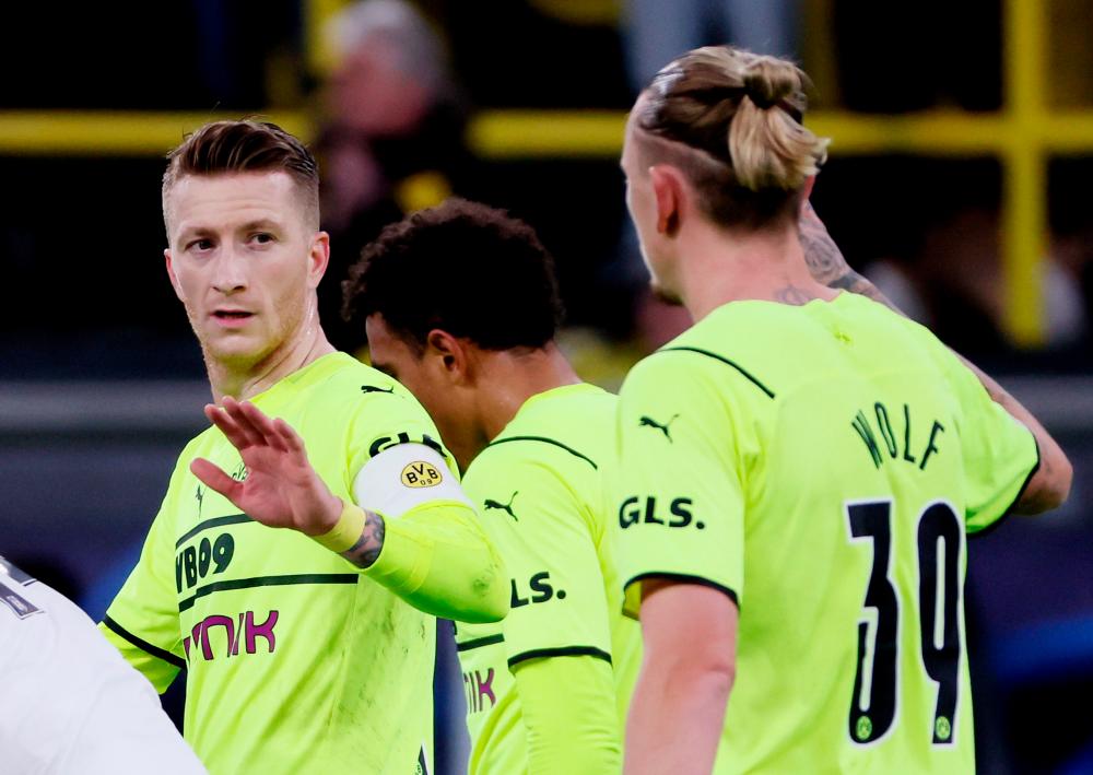 Soccer Football - Champions League - Group C - Borussia Dortmund v Besiktas - Signal Iduna Park, Dortmund, Germany - December 7, 2021Borussia Dortmund's Marco Reus celebrates scoring their second goal with Marius Wolf REUTERSPIX