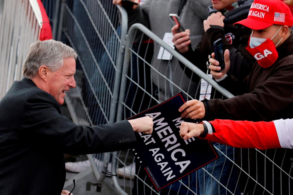 FILE PHOTO: White House Chief of Staff Mark Meadows greets supporters of U.S. President Donald Trump during a campaign rally at Reading Regional Airport in Reading Pennsylvania , U.S., October 31, 2020. REUTERSpix