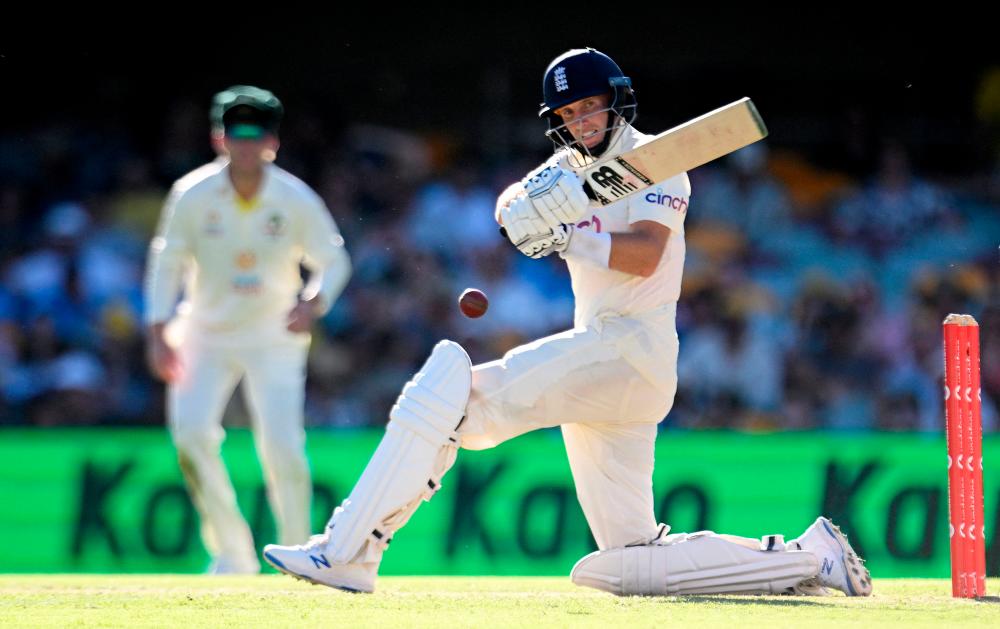 Cricket - Ashes - First Test - Australia v England - The Gabba, Brisbane, Australia - December 10, 2021England's Joe Root plays a shot on day 3 of the First Ashes TestDave Hunt/AAP via REUTERSpix