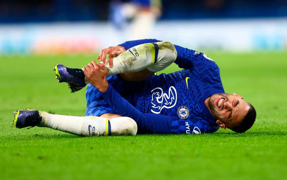 Soccer Football - Premier League - Chelsea v Everton - Stamford Bridge, London, Britain - December 16, 2021Chelsea's Hakim Ziyech reacts after sustaining an injury REUTERSPIX
