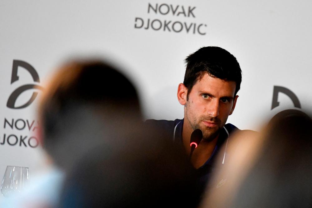 FILE PHOTO: FILE PHOTO: Former world No.1 tennis player Novak Djokovic speaks during a news conference in Belgrade, Serbia July 26, 2017. REUTERSPIX