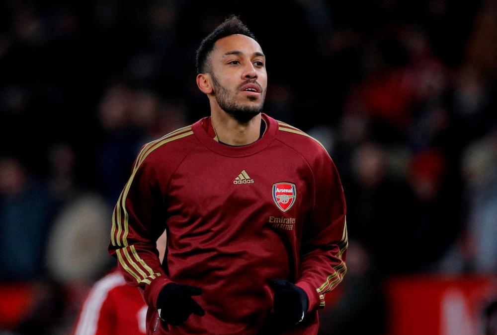 FILE PHOTO: Soccer Football - Premier League - Manchester United v Arsenal - Old Trafford, Manchester, Britain - December 2, 2021 Arsenal’s Pierre-Emerick Aubameyang during the warm up before the match REUTERSpix