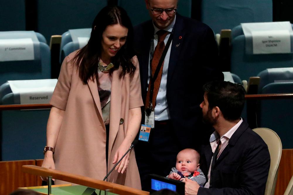 New Zealand Prime Minister Jacinda Ardern walks back to her baby Neve and partner Clarke Gayford, after speaking at the Nelson Mandela Peace Summit during the 73rd United Nations General Assembly in New York City, New York, U.S., September 24, 2018. REUTERSpix