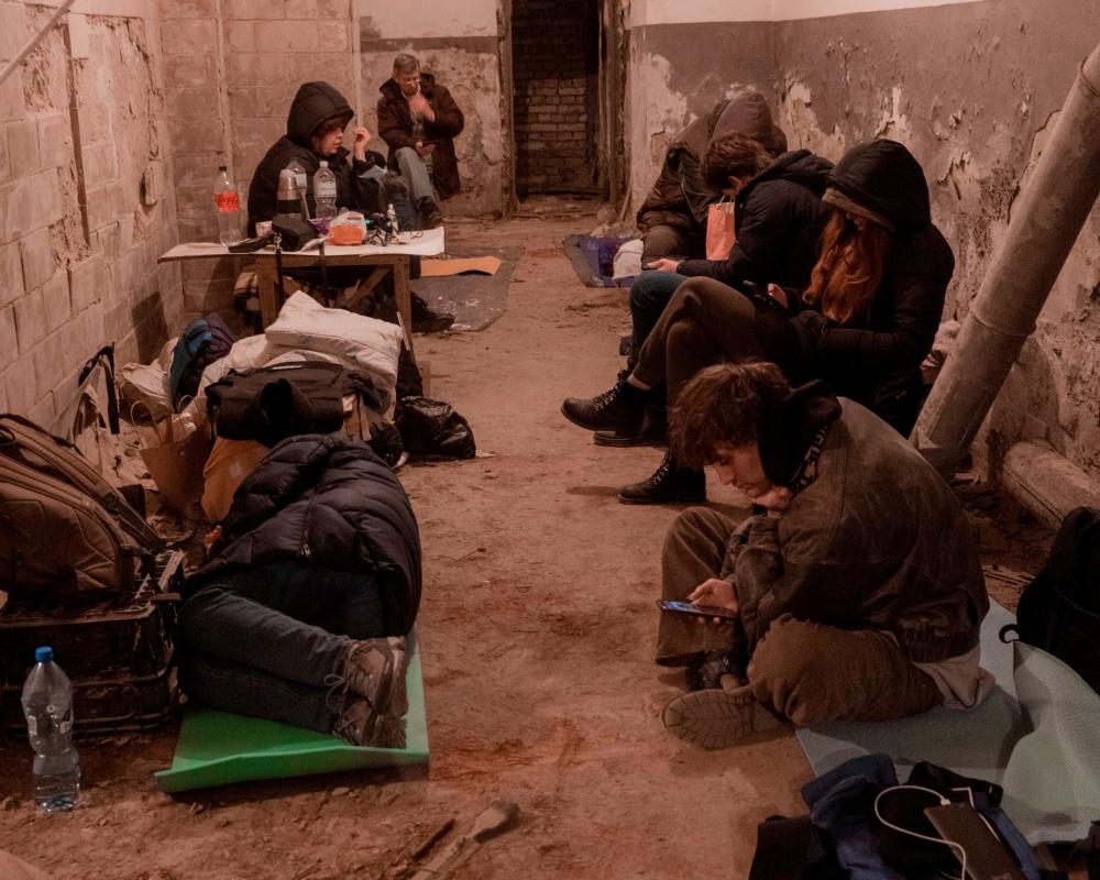 Residents take shelter in the basement of an apartment building, after Russia launched a massive military operation against Ukraine, in Kyiv, Ukraine early February 27, 2022. REUTERSpix
