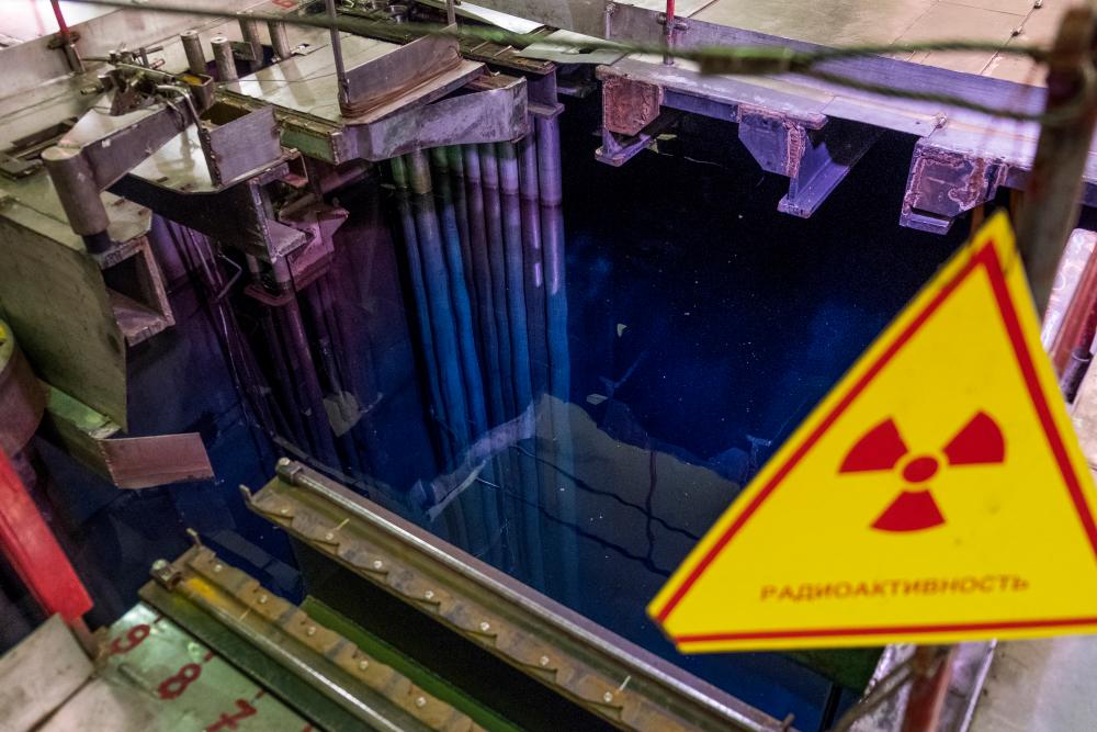 A view of fuel assemblies in water with a sign reading “Radioactivity” at a wet spent fuel storage facility (ISF-1) in Chernobyl, Ukraine. REUTERSPIX