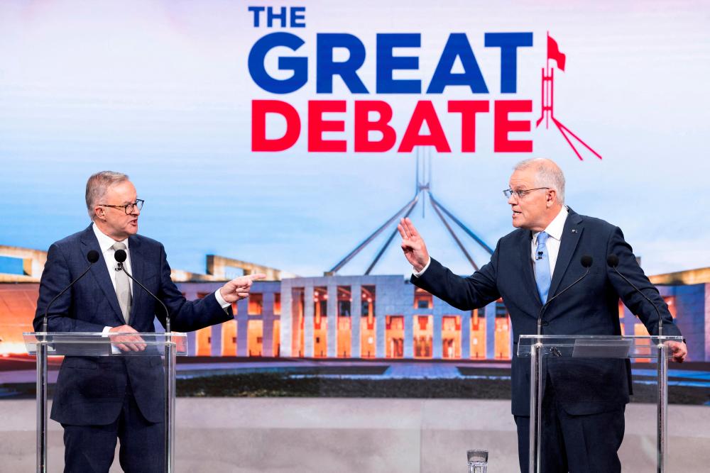 Australian incumbent Prime Minister Scott Morrison and Opposition Leader Anthony Albanese debate on live television ahead of the 2022 federal election, in Sydney, Australia May 8, 2022. - REUTERSPIX