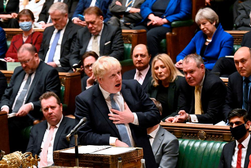 FILE PHOTO: British Prime Minister Boris Johnson makes a statement on Sue Gray’s report regarding the alleged Downing Street parties during Covid-19 lockdown, in the House of Commons in London, Britain, January 31, 2022. REUTERSPIX