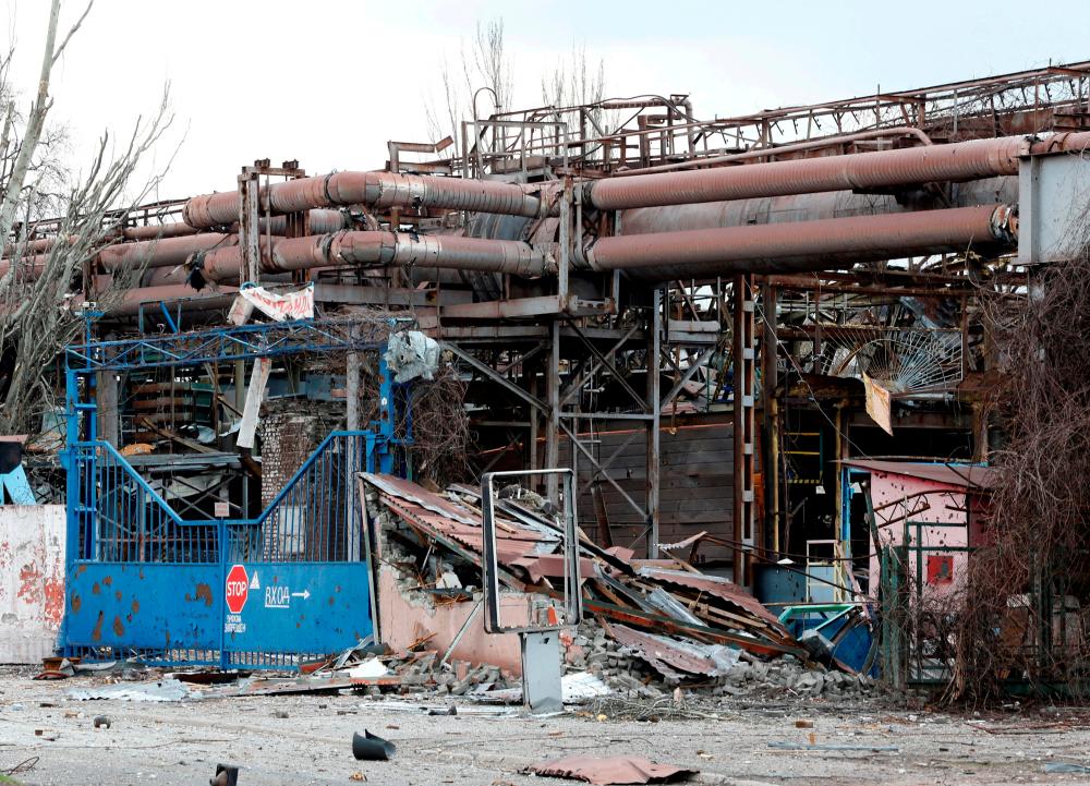 FILE PHOTO: A view shows the gates of the Illich Steel and Iron Works damaged during Ukraine-Russia conflict in the southern port city of Mariupol, Ukraine April 15, 2022. REUTERSPIX