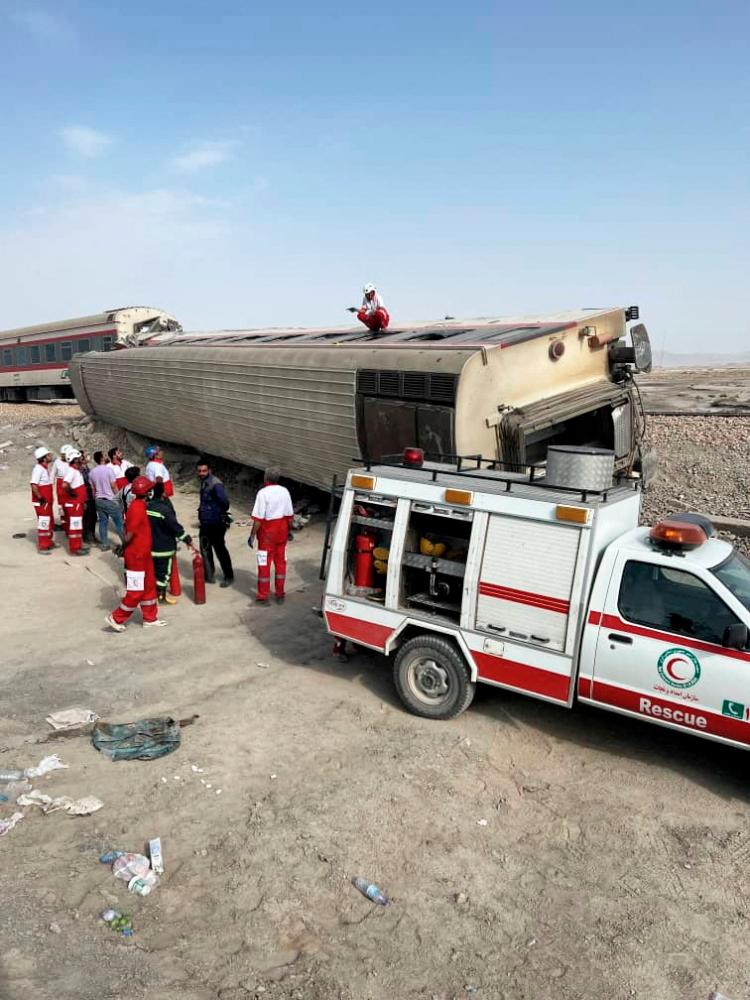 Rescuers work at a train derailment site near Tabas. - REUTERSPIX