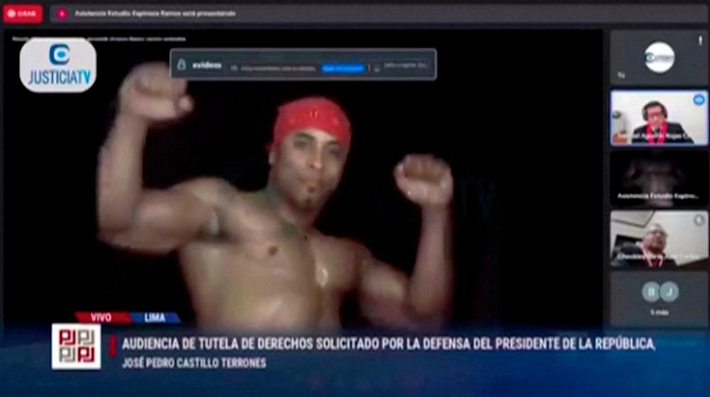 A video of Brazilian stripper Ricardo Milos appears on the screen interrupting a virtual public hearing of Peruvian President Pedro Castillo’s corruption investigation, in Lima/REUTERPix