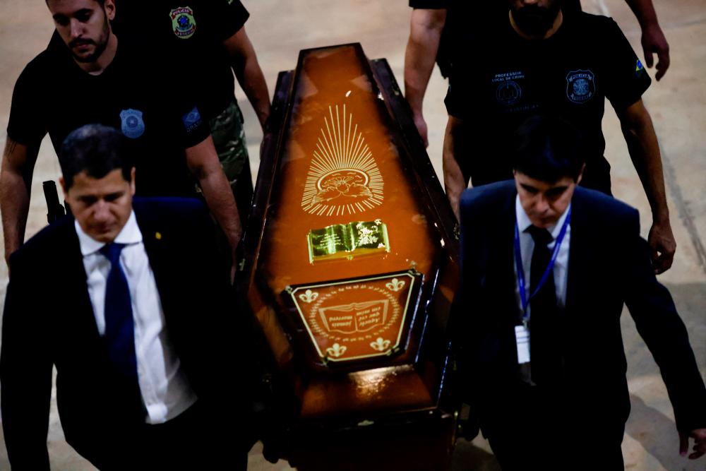 Federal Police officers carry a coffin containing human remains after a suspect confessed to killing British journalist Dom Phillips and Brazilian indigenous expert Bruno Pereira and led police to the location of remains, at the headquarters of the Federal Police, in Brasilia, Brazil/REUTERSPix