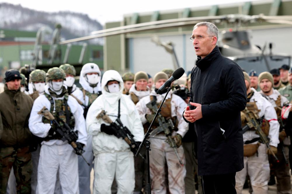 FILE PHOTO: NATO Secretary General Jens Stoltenberg addresses the troops as part of a military exercise called Cold Response 2022, gathering around 30,000 troops from NATO member countries plus Finland and Sweden, amid Russia's invasion of Ukraine, at a base in Bardufoss in the Arctic Circle, Norway, March 25, 2022. - REUTERSPIX