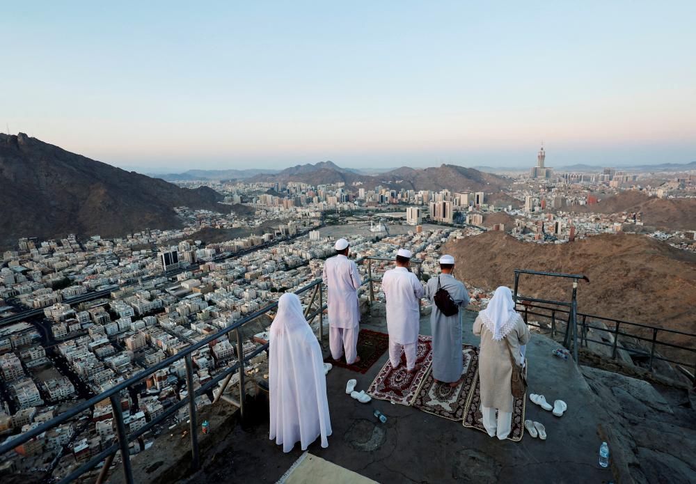 Muslim pilgrims visit Mount Al-Noor, where Muslims believe Prophet Mohammad received the first words of the Koran through Gabriel in the Hira cave, in the holy city of Mecca, Saudi Arabia, July 4, 2022. - REUTERSPIX