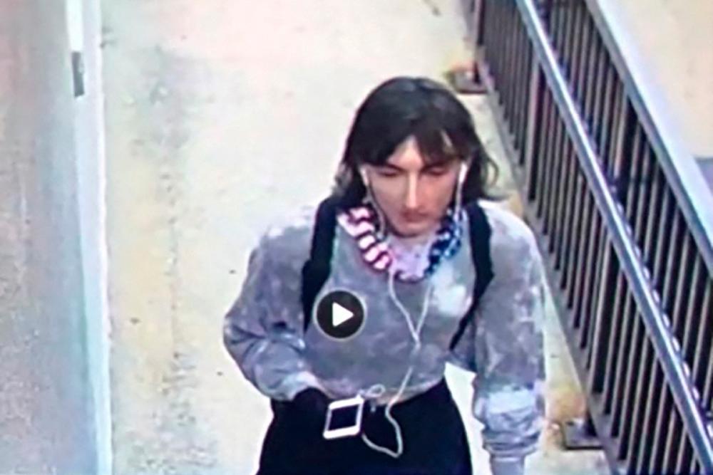 A still image from surveillance footage shows a person who police believe to be Robert (Bob) E. Crimo III, a person of interest in the mass shooting that took place at a Fourth of July parade route in the Chicago suburb of Highland Park, Illinois, U.S. dressed in women’s clothing on July 4, 2022. Highland Park Police Department/Handout via Reuters