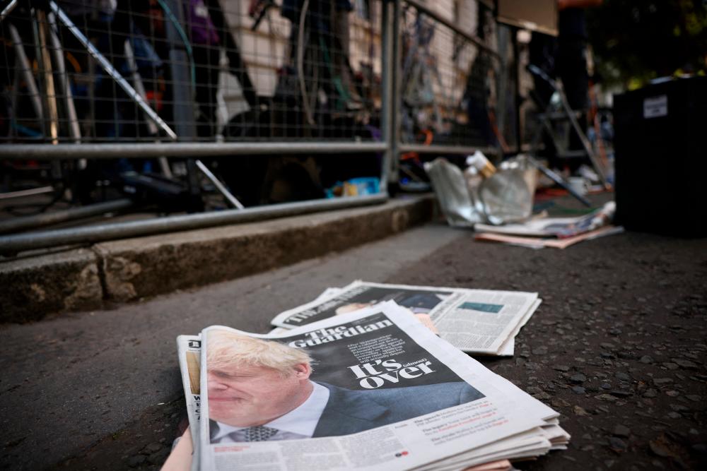 Newspapers reporting the resignation of Boris Johnson lay on the floor at Downing Street in London, Britain, July 8, 2022. REUTERSPIX