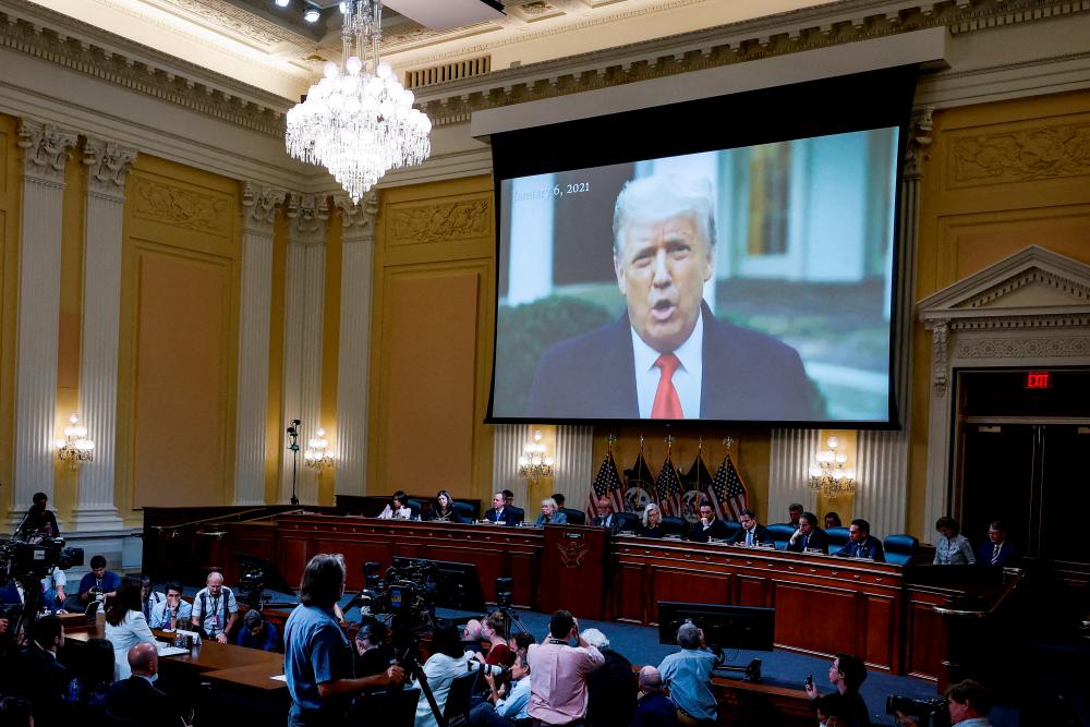 FILE PHOTO: A video of former U.S. President Donald Trump is played as Cassidy Hutchinson, who was an aide to former White House Chief of Staff Mark Meadows during the Trump administration, testifies during a House Select Committee public hearing that investigates the January 6 Attack on the U.S. Capitol, at the Capitol, in Washington, U.S., June 28, 2022. REUTERSPIX