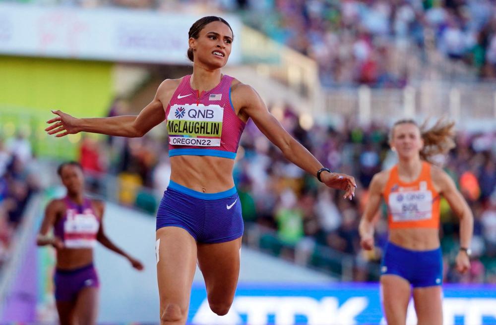 Sydney McLaughlin of the U.S. crosses the line to win the women's 400 metres hurdles final and set a world record. REUTERSPIX