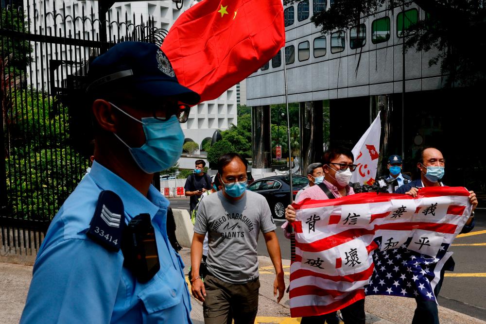 Pro-China supporters protest against U.S. House of Representatives Speaker Nancy Pelosi’s visit to Taiwan, in Hong Kong, China August 3, 2022. REUTERSPIX