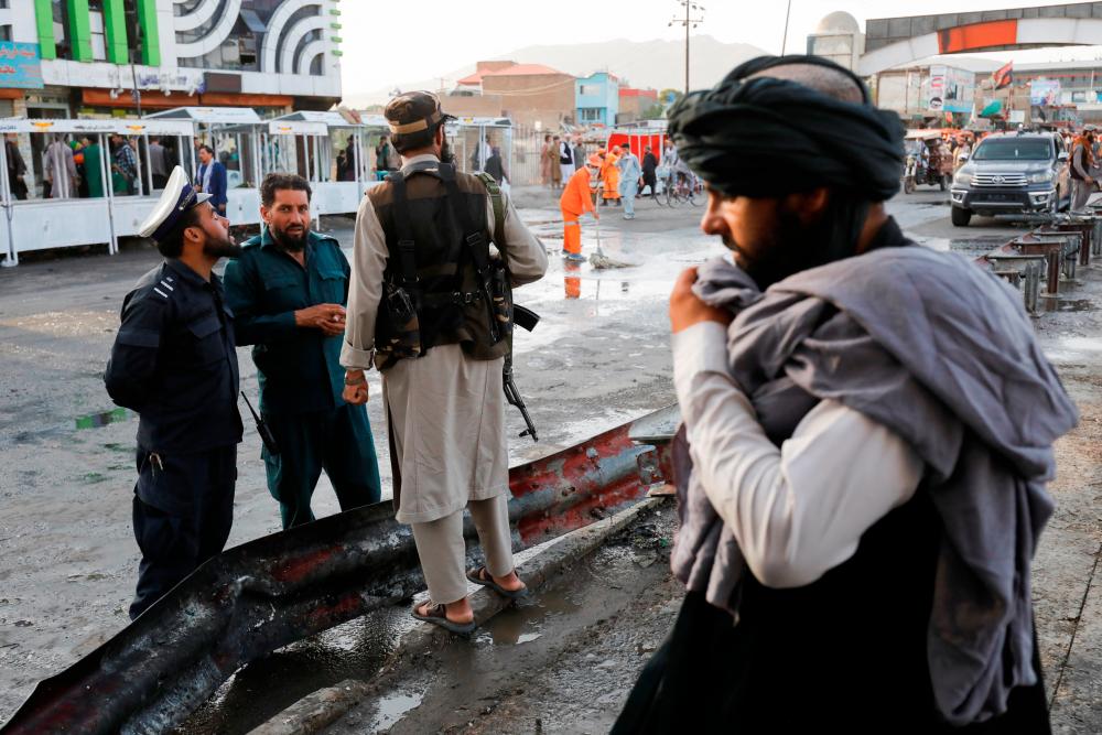 Taliban fighters stand guard at the site of a blast in Kabul, Afghanistan, August 6, 2022. REUTERSpix