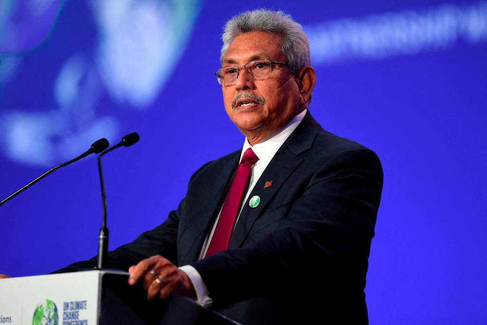 FILE PHOTO: Sri Lanka's then president, Gotabaya Rajapaksa, presenting his national statement during the World Leaders' Summit at the UN Climate Change Conference (COP26) in Glasgow, Scotland, Britain November 1, 2021. - REUTERSPIX