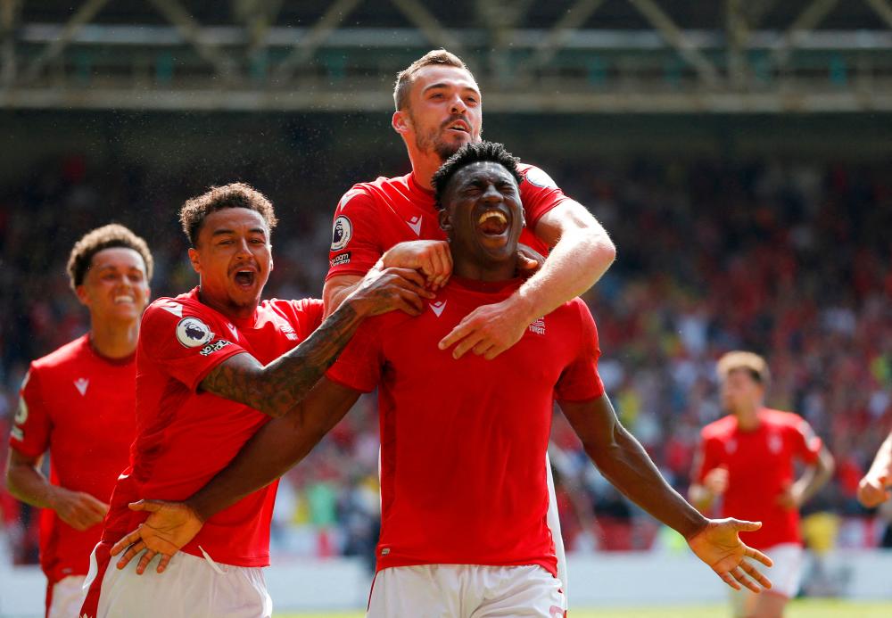 Soccer Football - Premier League - Nottingham Forest v West Ham United - The City Ground, Nottingham, Britain - August 14, 2022 Nottingham Forest’s Taiwo Awoniyi scores their first goal with teammates REUTERSPIX