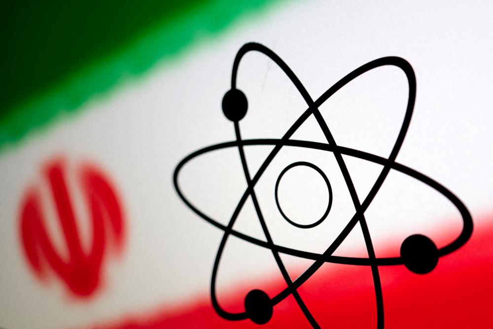 FILE PHOTO: The atomic symbol and the Iranian flag are seen in this illustration, July 21, 2022. - REUTERSPIX