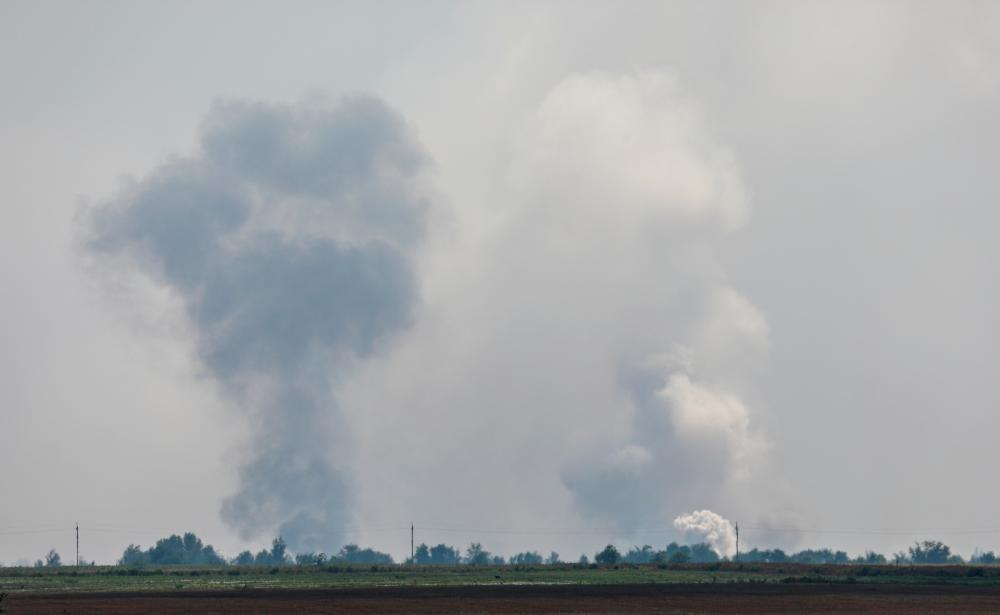 A view shows smoke rising above the area following an alleged explosion in the village of Mayskoye in the Dzhankoi district, Crimea, August 16, 2022. - REUTERSPIX