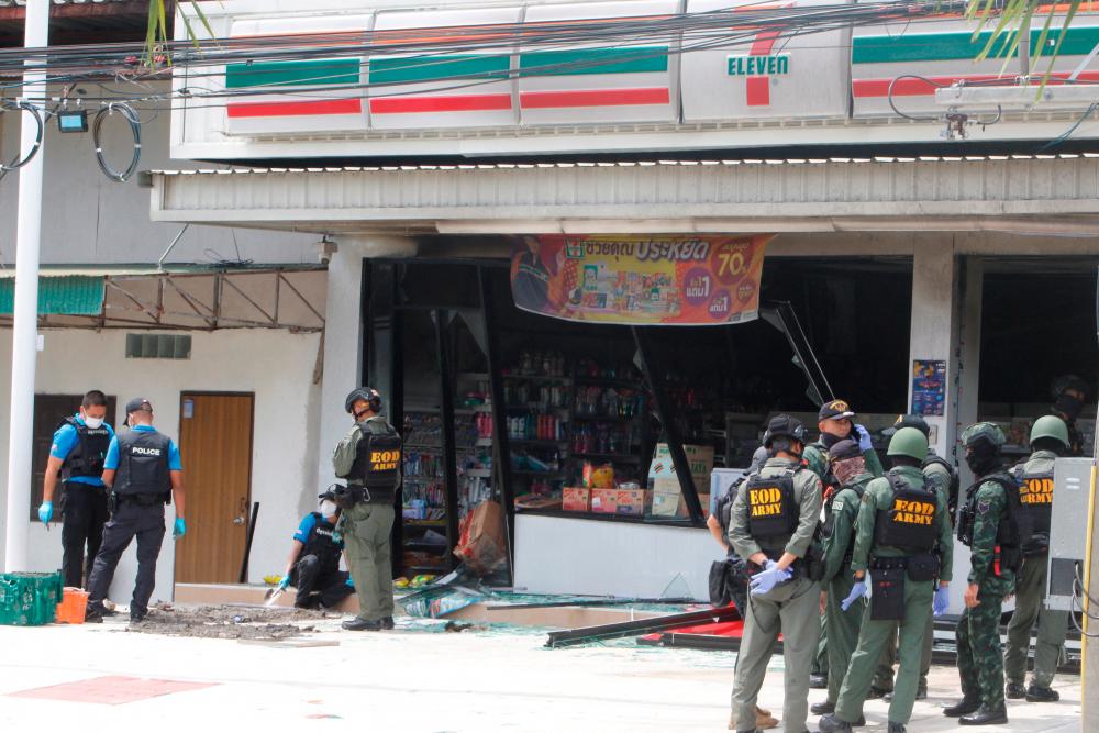 Emergency service members work in front of a shop after an explosion ripped through the southern Thailand province of Yala in what appeared to be multiple coordinated attacks in several locations, in Yala, Thailand August 17, 2022. REUTERSPIX