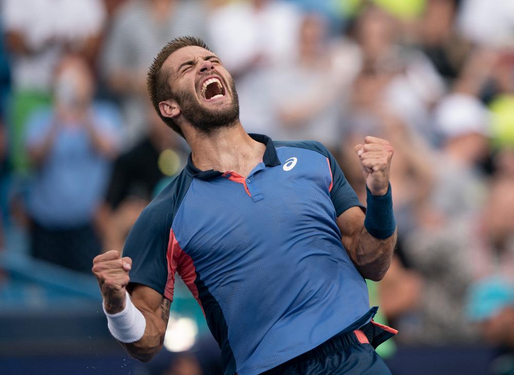 Aug 21, 2022; Cincinnati, OH, USA; Borna Coric (CRO) celebrates winning the men’s final match against Stefanos Tsitsipas (GRE) at the Western &amp; Southern Open at the Lindner Family Tennis Center. - REUTERSPIX
