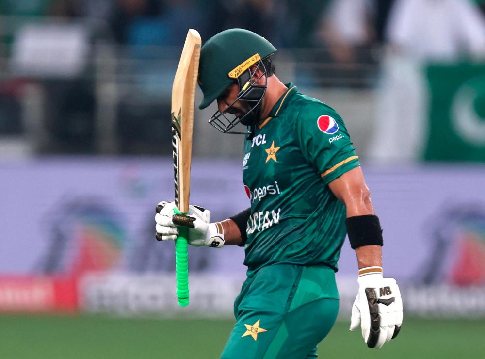 Cricket - Asia Cup - Final - Pakistan v Sri Lanka - Dubai International Stadium, Dubai, United Arab Emirates - September 11, 2022. Pakistan's Iftikhar Ahmed walks after losing his wicket - REUTERSPIX