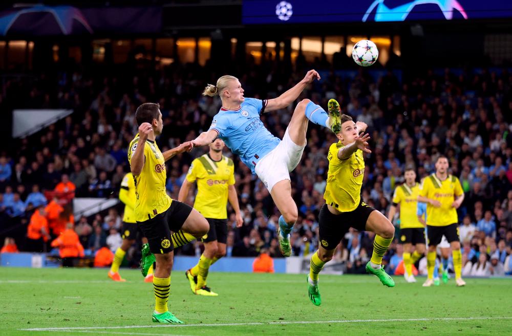 Soccer Football - Champions League - Group G - Manchester City v Borussia Dortmund - Etihad Stadium, Manchester, Britain - September 14, 2022 Manchester City’s Erling Braut Haaland scores their second goal. REUTERSPIX