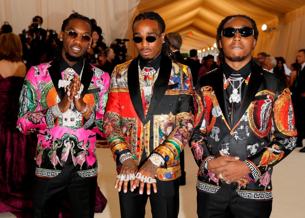FILE PHOTO: (L-R) Takeoff, Quavo and Offset of Migos arrive at the Metropolitan Museum of Art Costume Institute Gala (Met Gala) to celebrate the opening of “Heavenly Bodies: Fashion and the Catholic Imagination” in the Manhattan borough of New York, U.S., May 7, 2018. REUTERSPIX