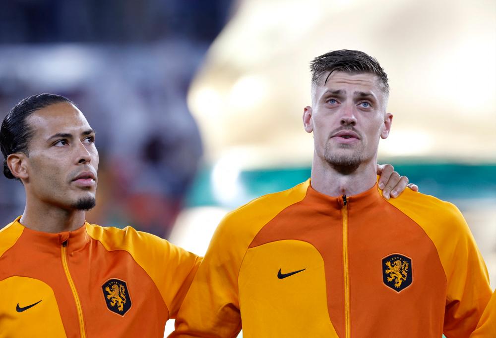 FIFA World Cup Qatar 2022 - Group A - Senegal v Netherlands - Al Thumama Stadium, Doha, Qatar - November 21, 2022 Netherlands’ Virgil van Dijk and Andries Noppert during the national anthems before the match. REUTERSPIX