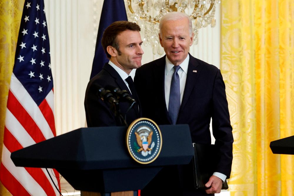 French President Emmanuel Macron greets US President Joe Biden at the conclusion of their joint news conference in the East Room of the White House in Washington, US, December 1, 2022. REUTERSPIX