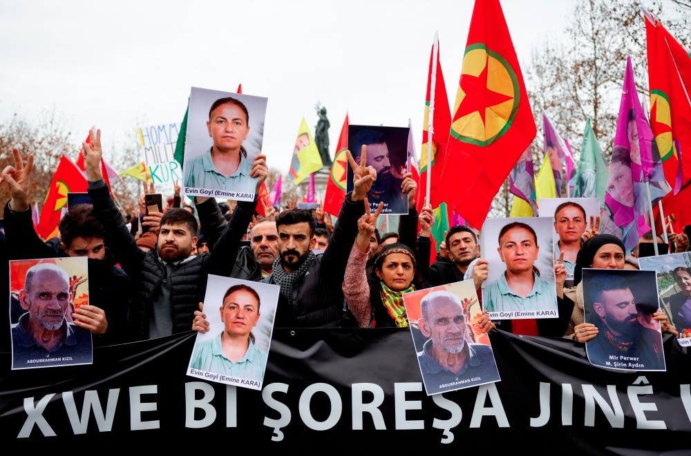 Members of the Kurdish community gather at the Place de la Republique square, following a shooting, in Paris, France December 24, 2022. - REUTERSPIX