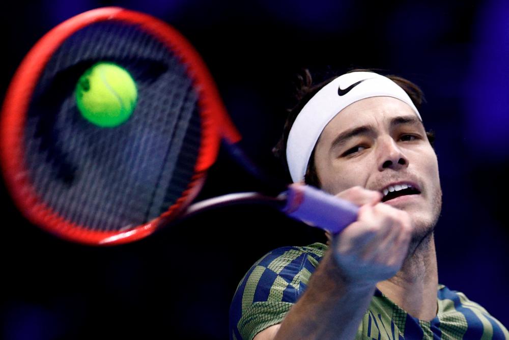 FILE PHOTO: Tennis - ATP Finals Turin - Pala Alpitour, Turin, Italy - November 19, 2022Taylor Fritz of the U.S. in action during his semi-final match against Serbia's Novak Djokovic REUTERS/Guglielmo Mangiapane/File Photo